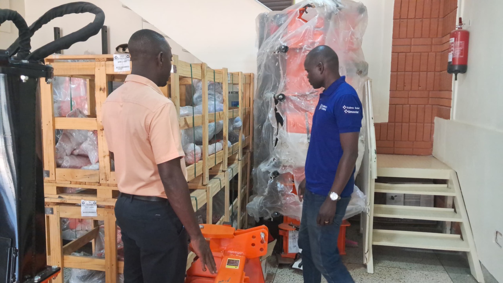 Crated implements and equipment in the Devise Solutions store in Kampala